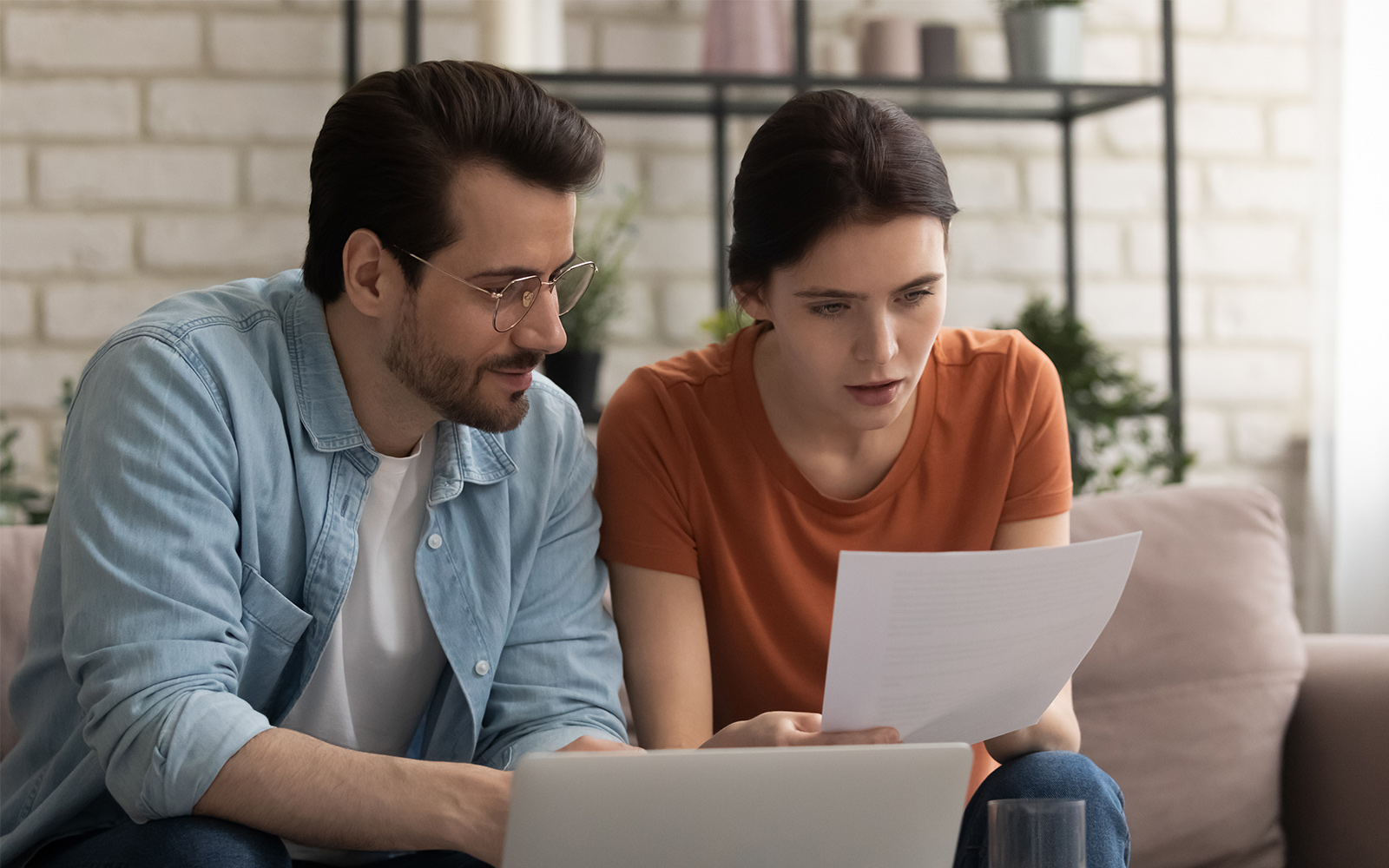 Couple looking at financial statements together