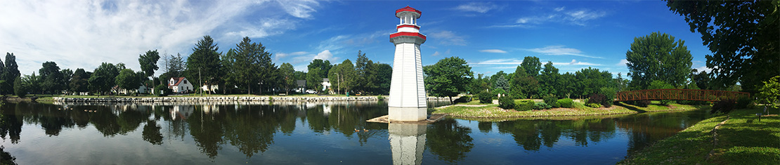 White and red lighthouse over a body of water