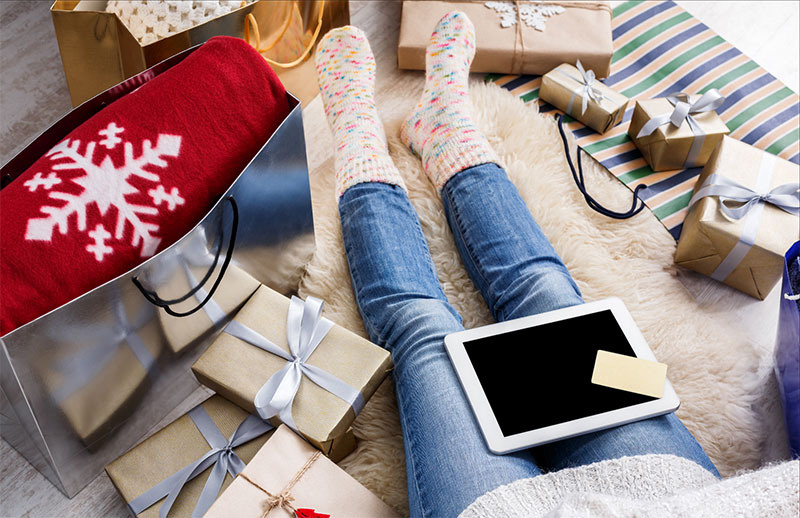 Person sitting with a tablet on their lap