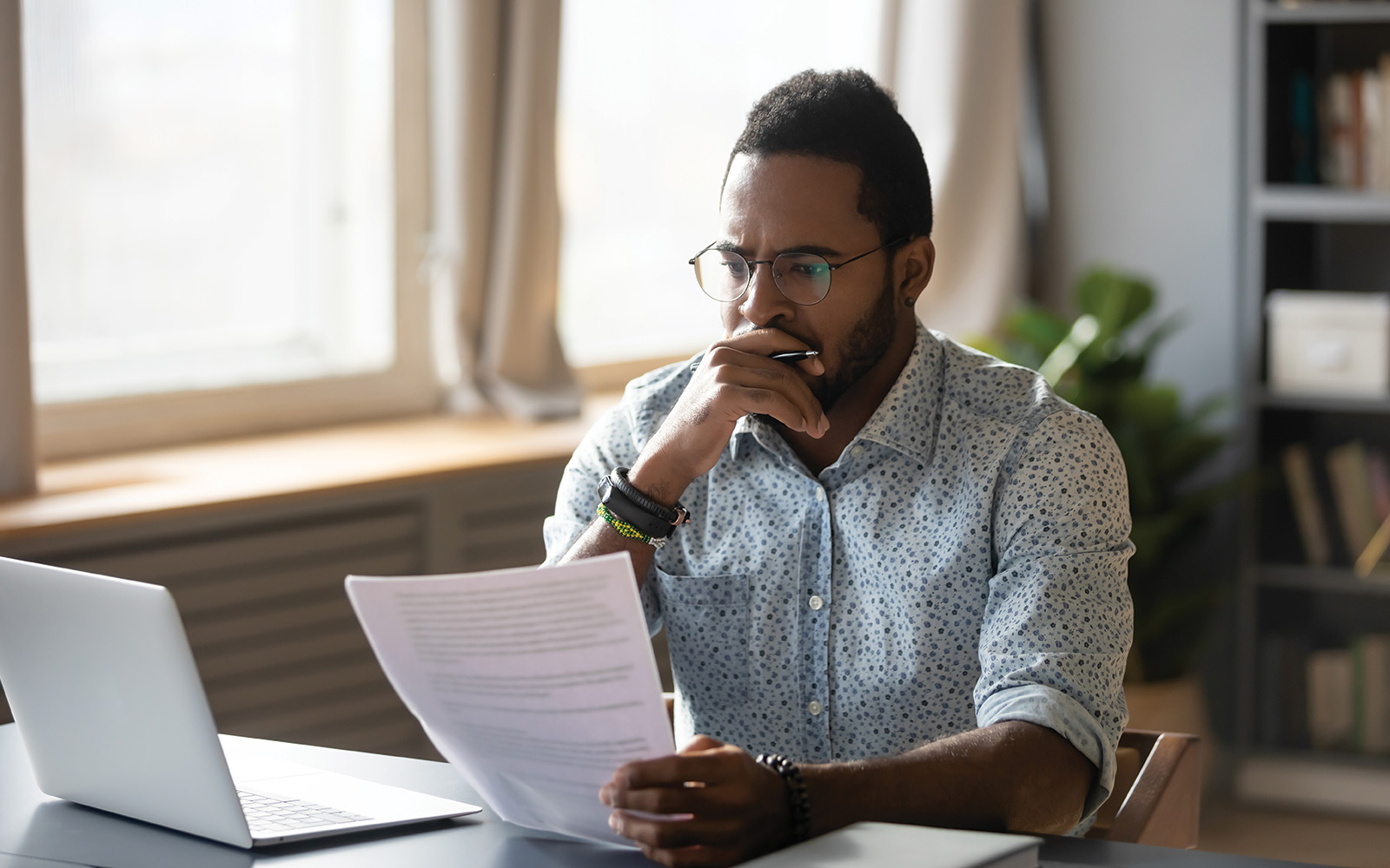 Young professional looking over his options