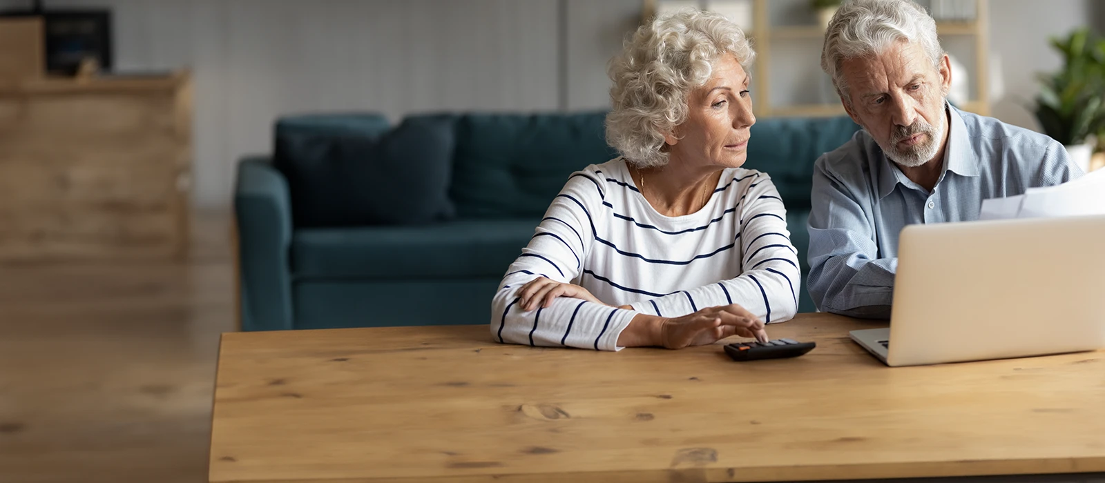 middle aged retired family couple managing paperwork