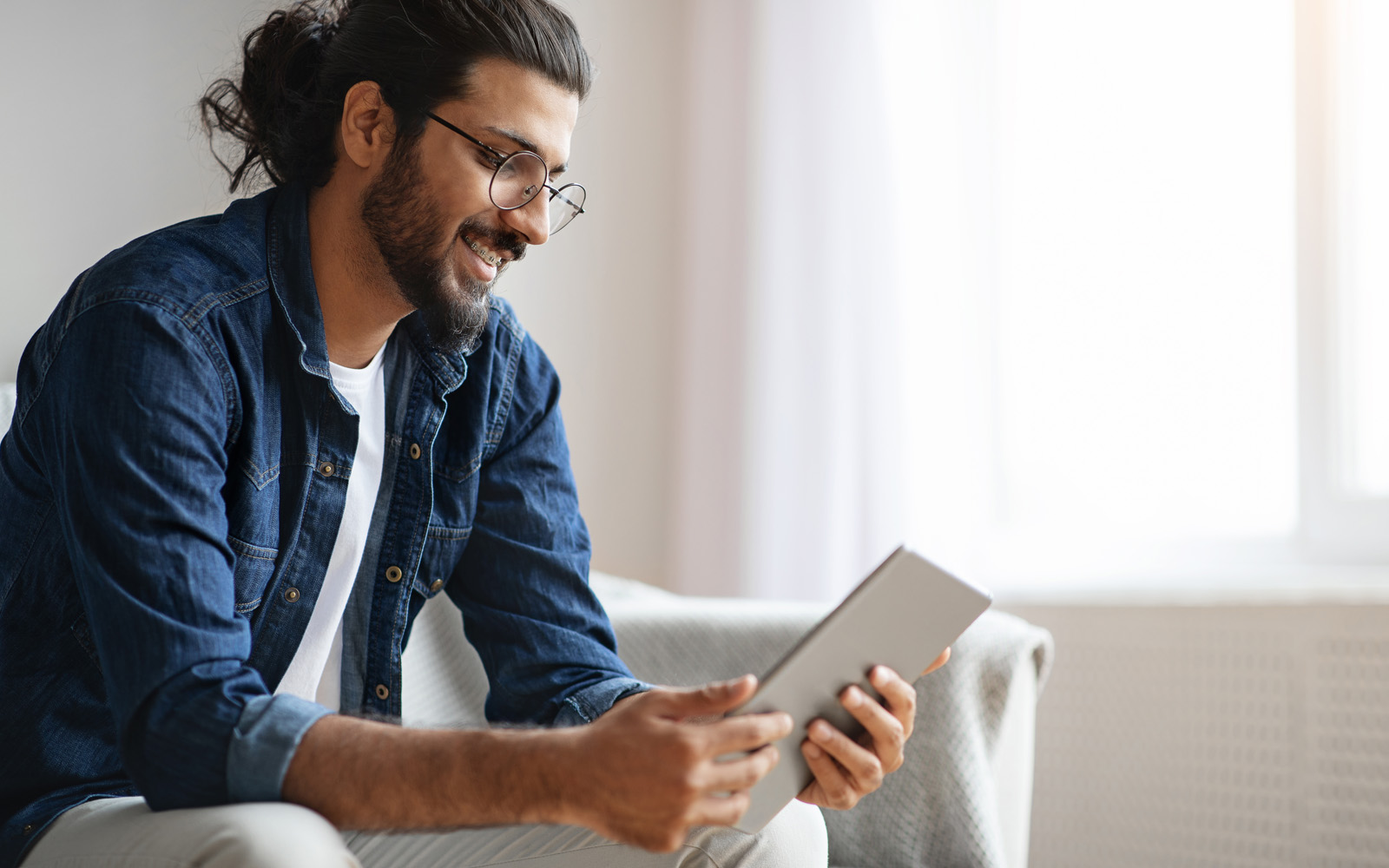 Photo of a person holding a tablet