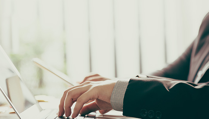 Person typing on a laptop