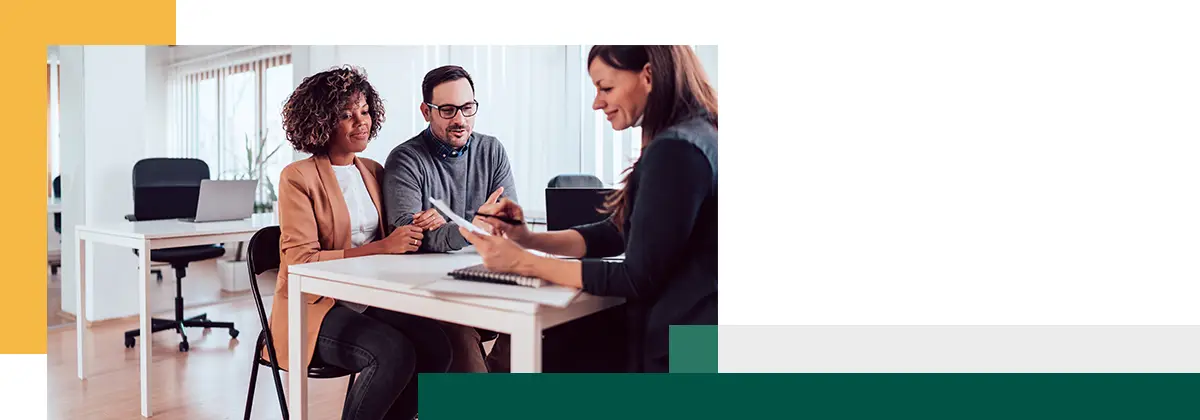Couple talking to an advisor on a meeting
