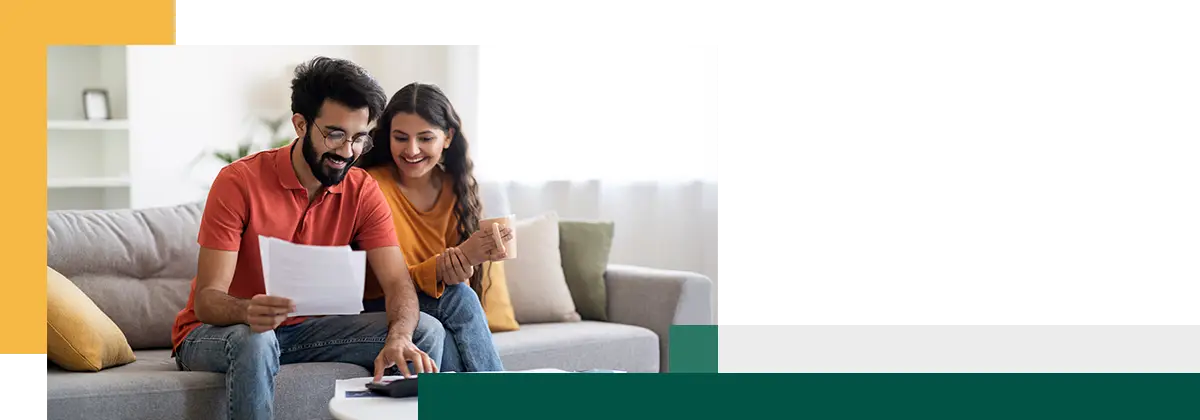 Spouses Checking Financial Documents And Calculating Family Budget At Home