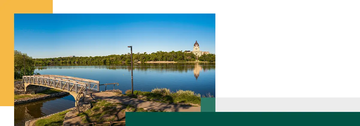 Tranquil Wascana Lake and the bridge along the walking trail of the lake park in Regina, Saskatchewan