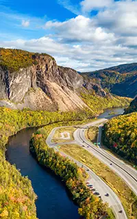 Scenic road in Canadian Mountain Landscape Valley with River Fall Season Corner Brook Newfoundland