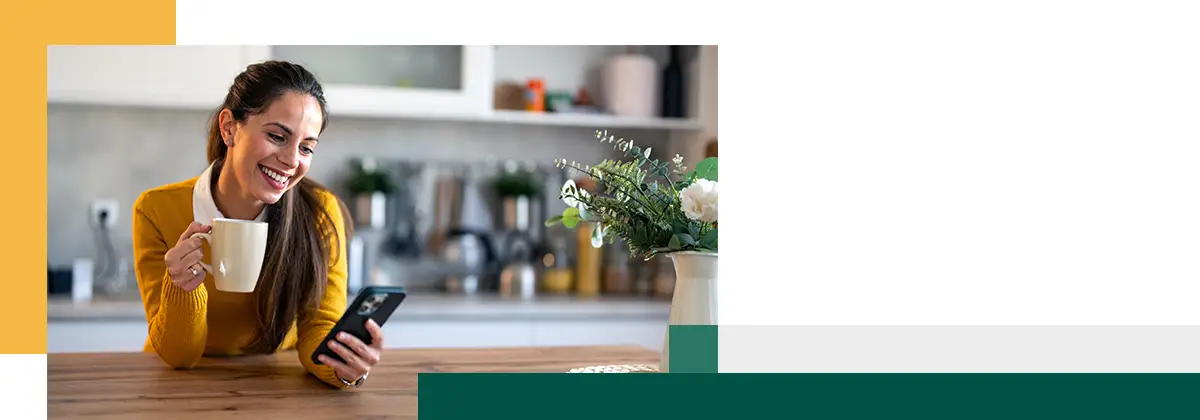 Person on smart phone while sitting at kitchen counter