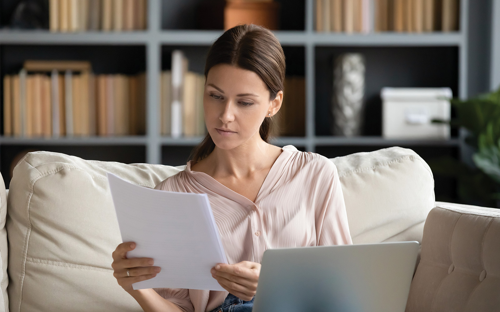 person reading a budget at home