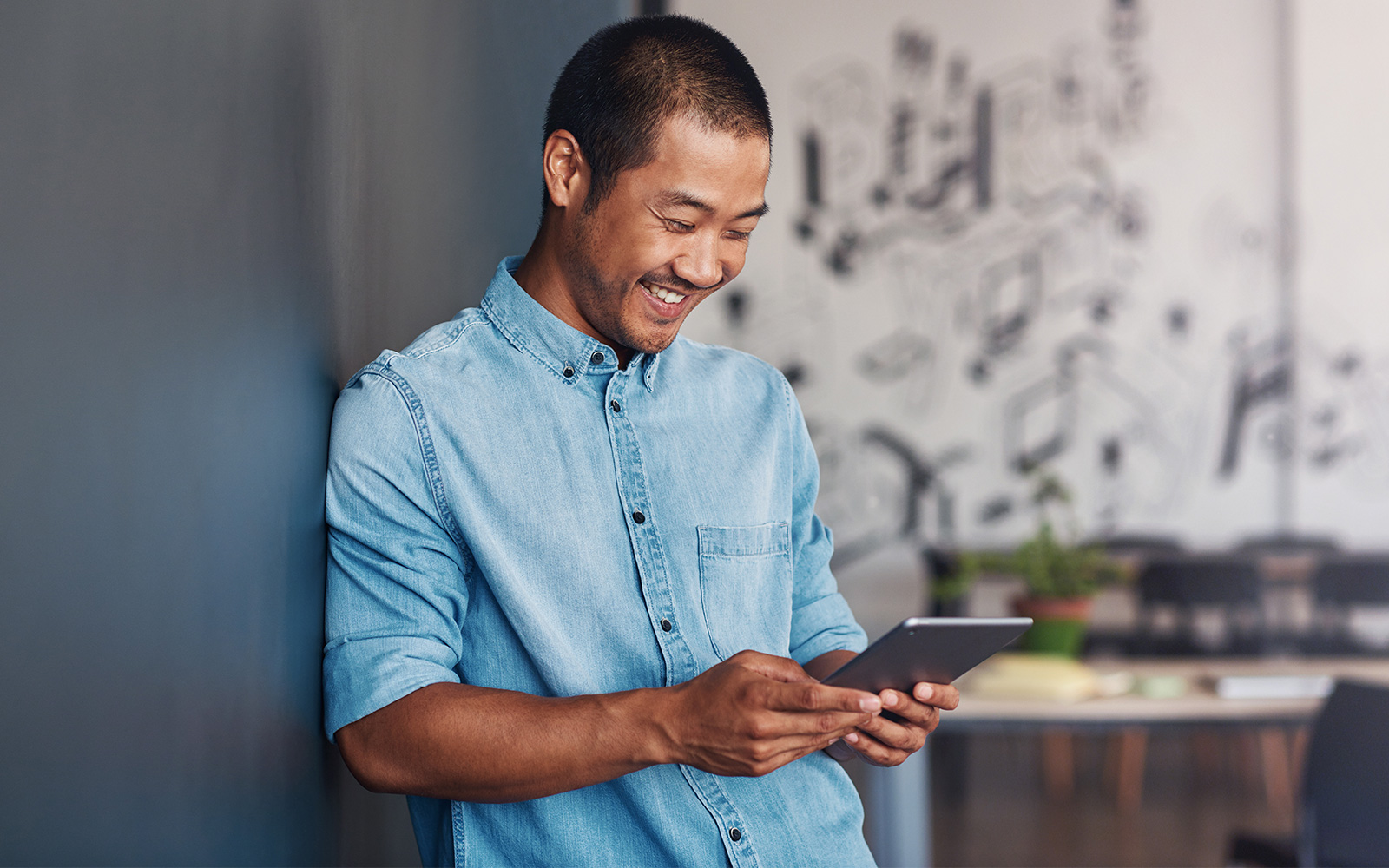 small business owner looking at business options on tablet