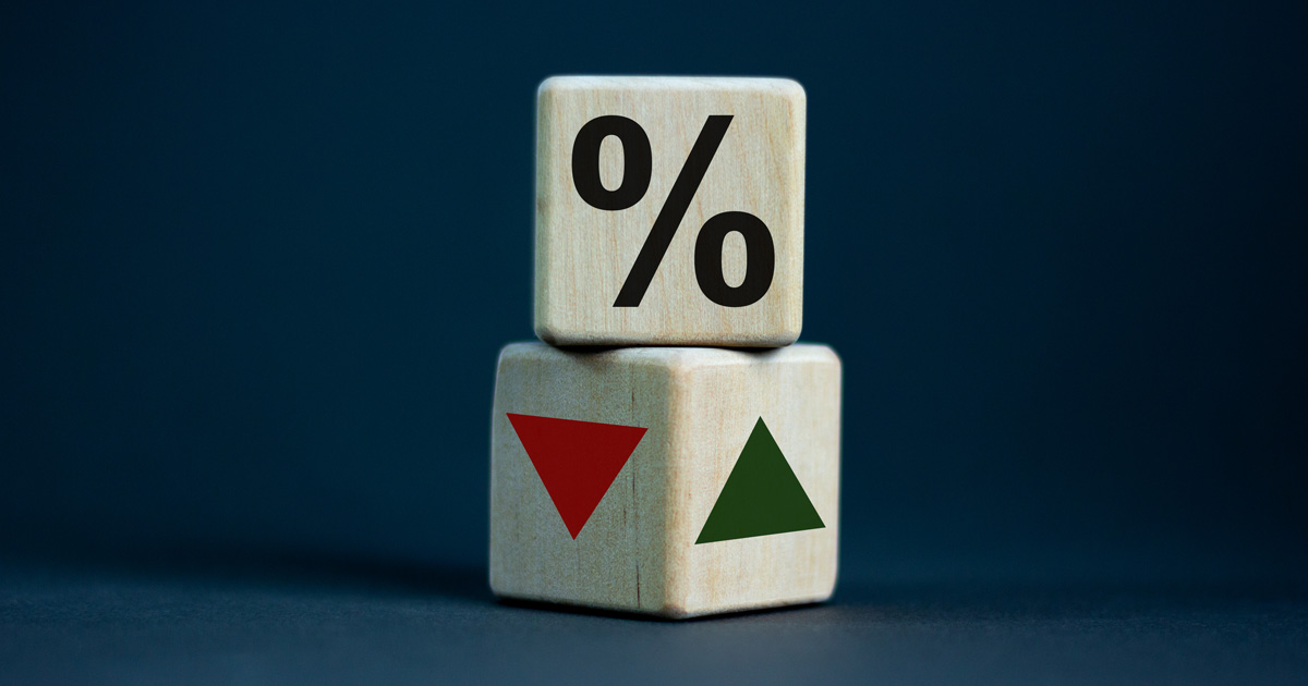 two wooden cubes stacked on top of each other symbolizing the interest rates