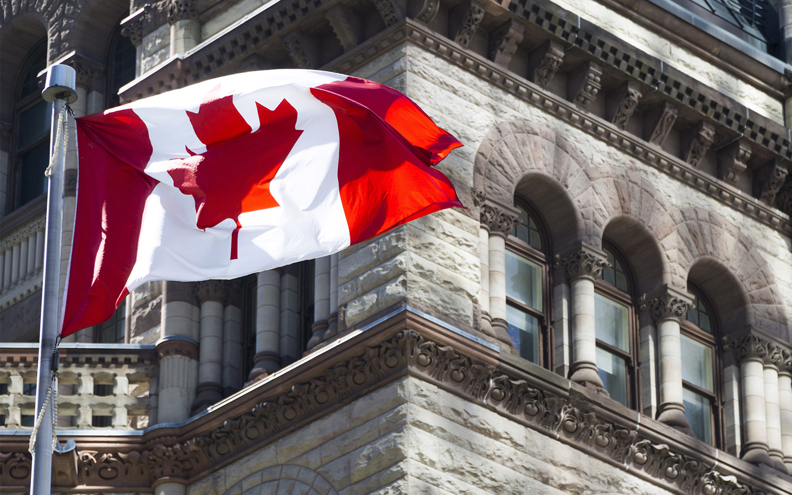 Canadian flag in front of parliament building