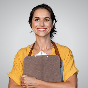 Female professional holding a clipboard