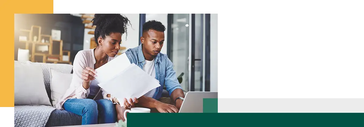 Couple laptop or finance with paperwork