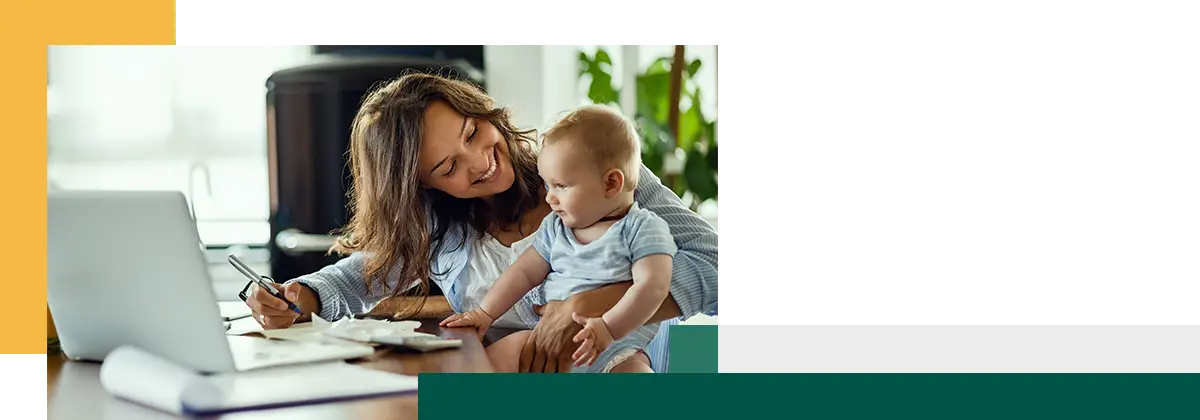 Young happy mother going through home finances
