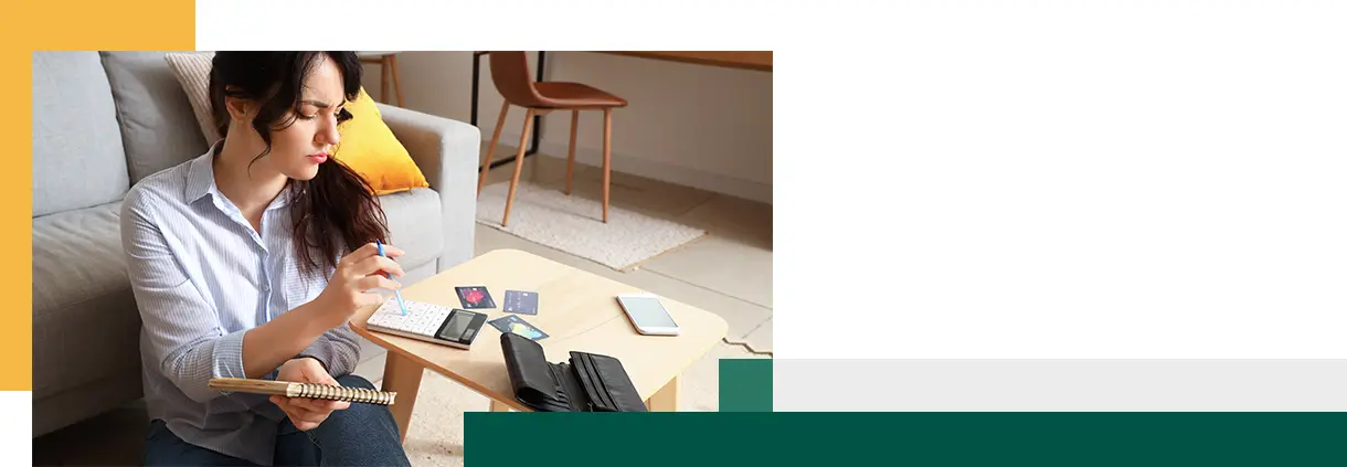 Young woman planning budget at home