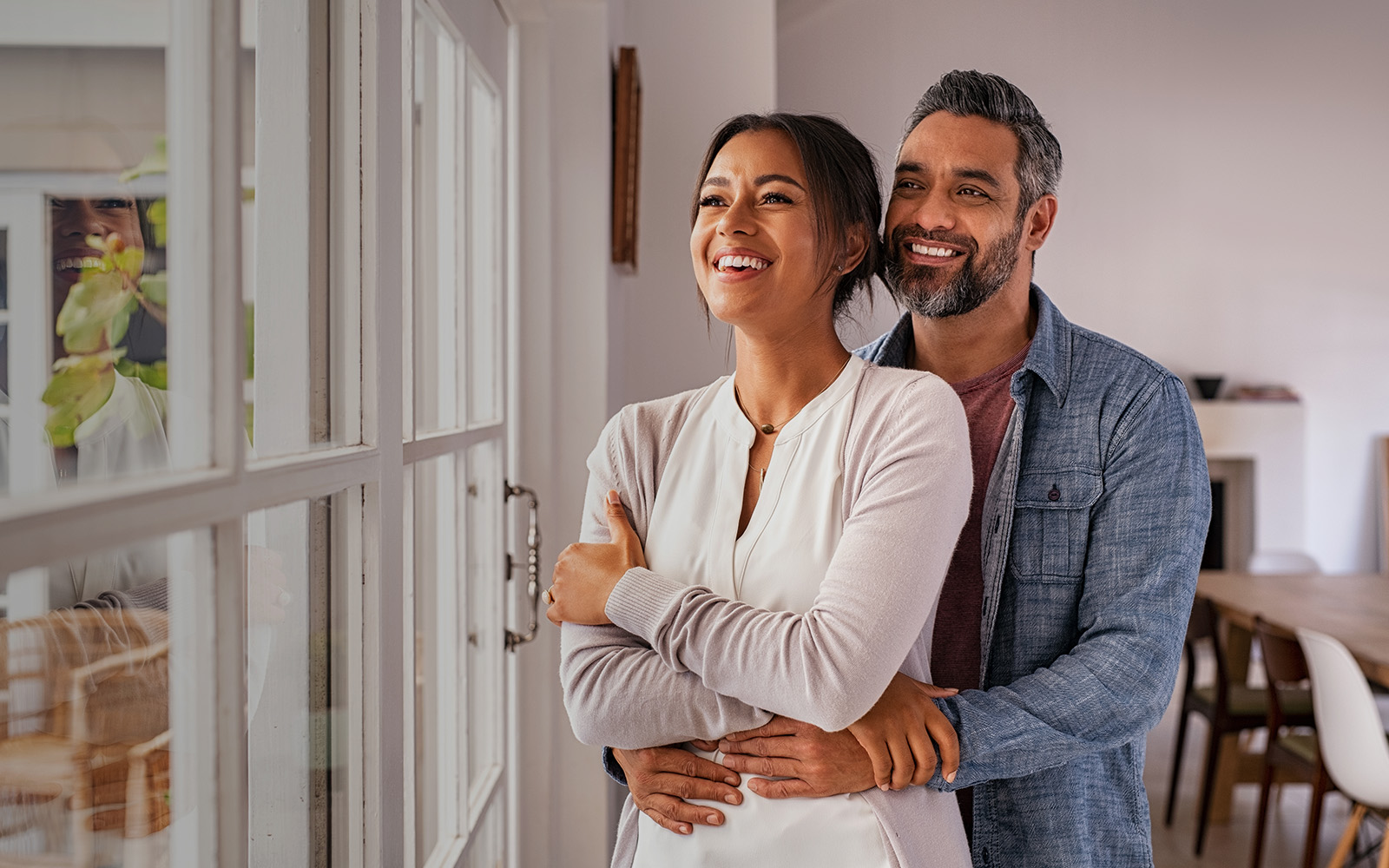 couple hugging and looking out the window