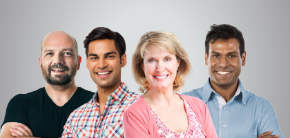 Group of people standing next to each other and smiling at the camera.