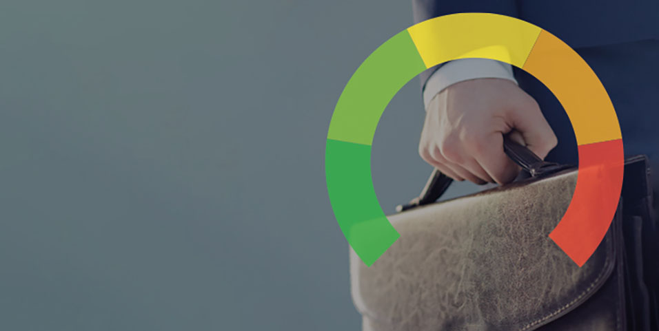 Business person holding a brown leather suitcase. Green to red meter overtop showing different stages of corporate crisis.