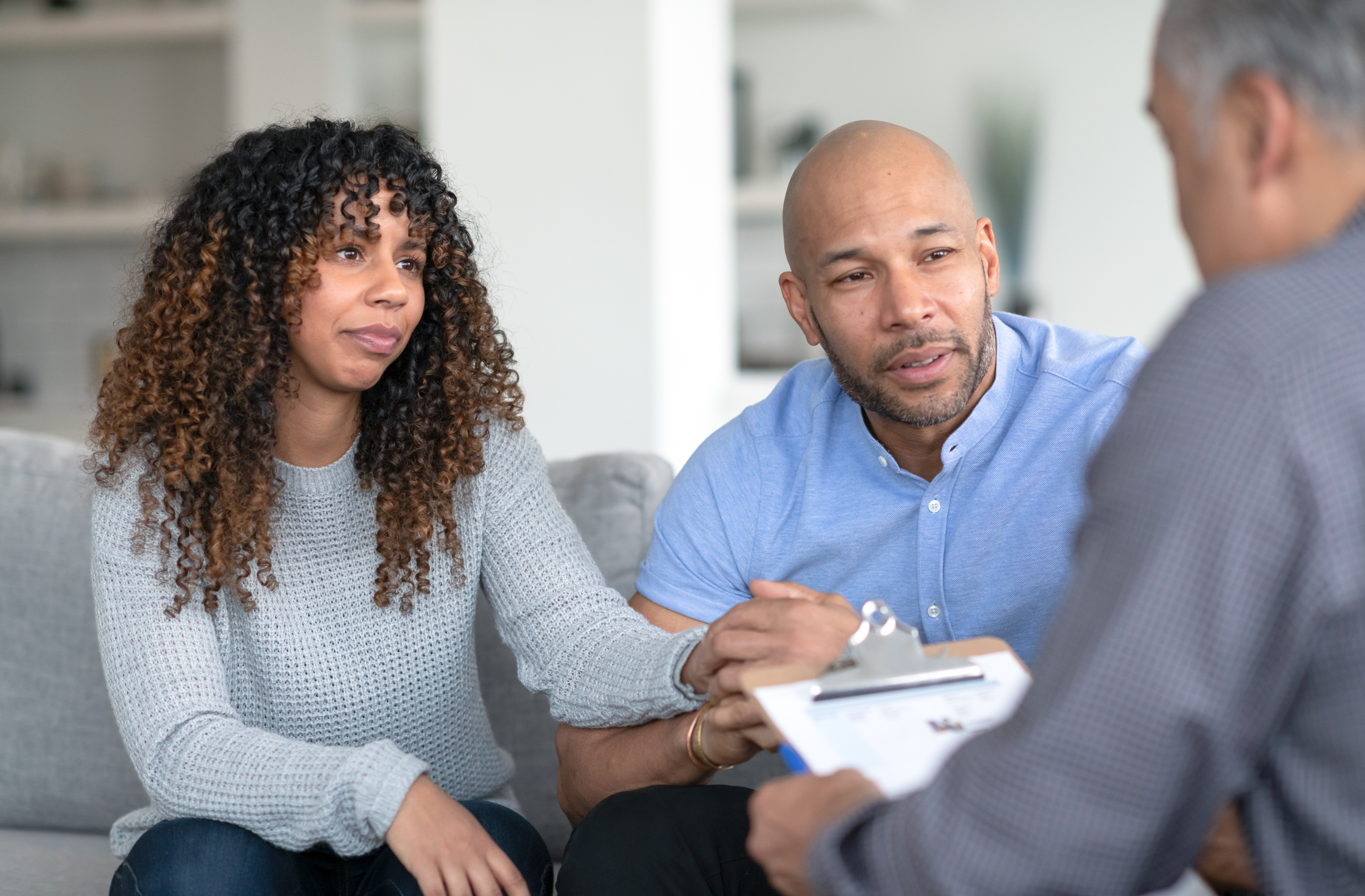 Couple discussing the consumer proposal process with a Licensed Insolvency Trustee.