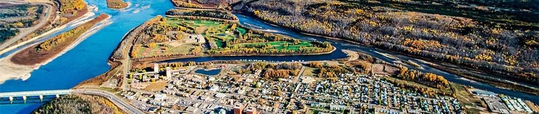 Aerial view of Fort McMurray beside the river.
