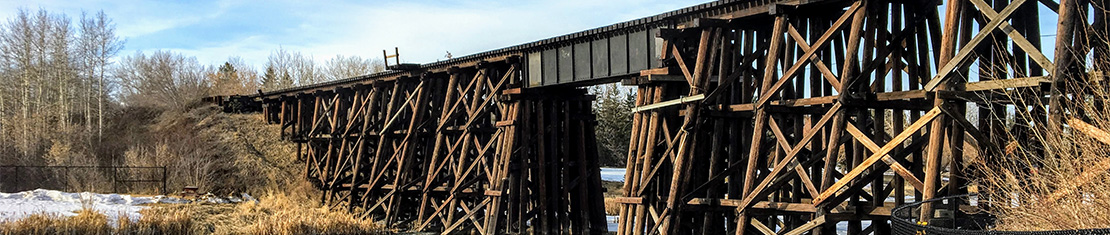 Train bridge over a body of water.
