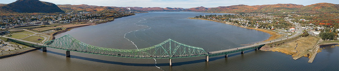 Copper bridge turned green over a body of water