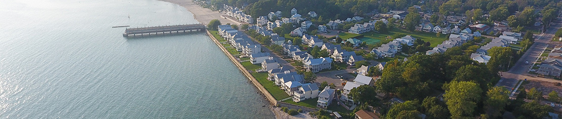 Aerial view of Ft Erie coastline with a large pier set on the water.