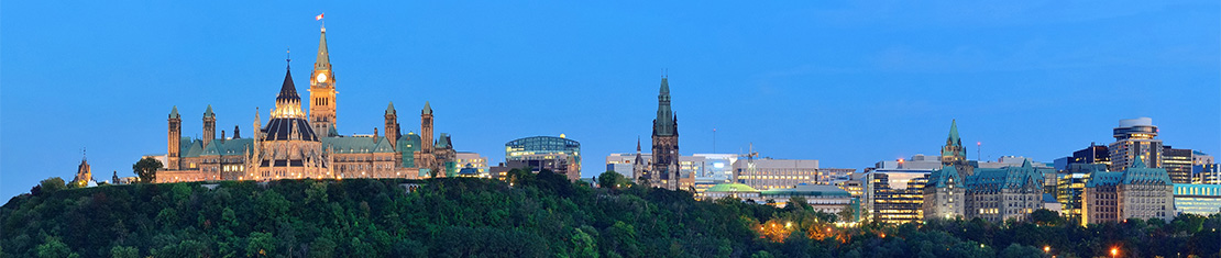 Parliament hill lit up at dusk
