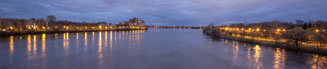 St. Lawrence river at dusk with street lights lighting up the coast line