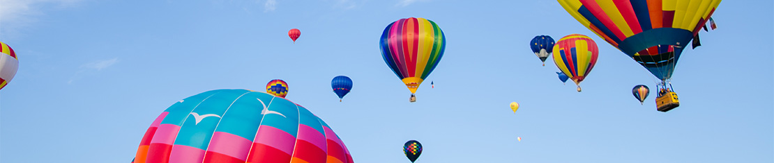 Colourful hot air balloons floating in the sky