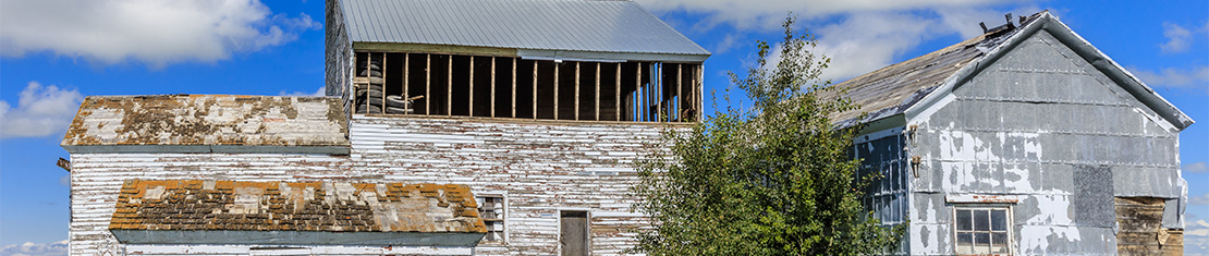 Faded white barns